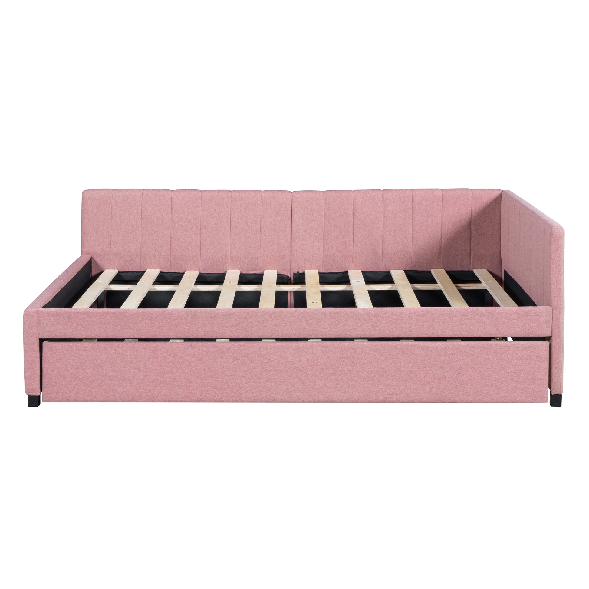Pink upholstered daybed with pullout trundle and wooden slats