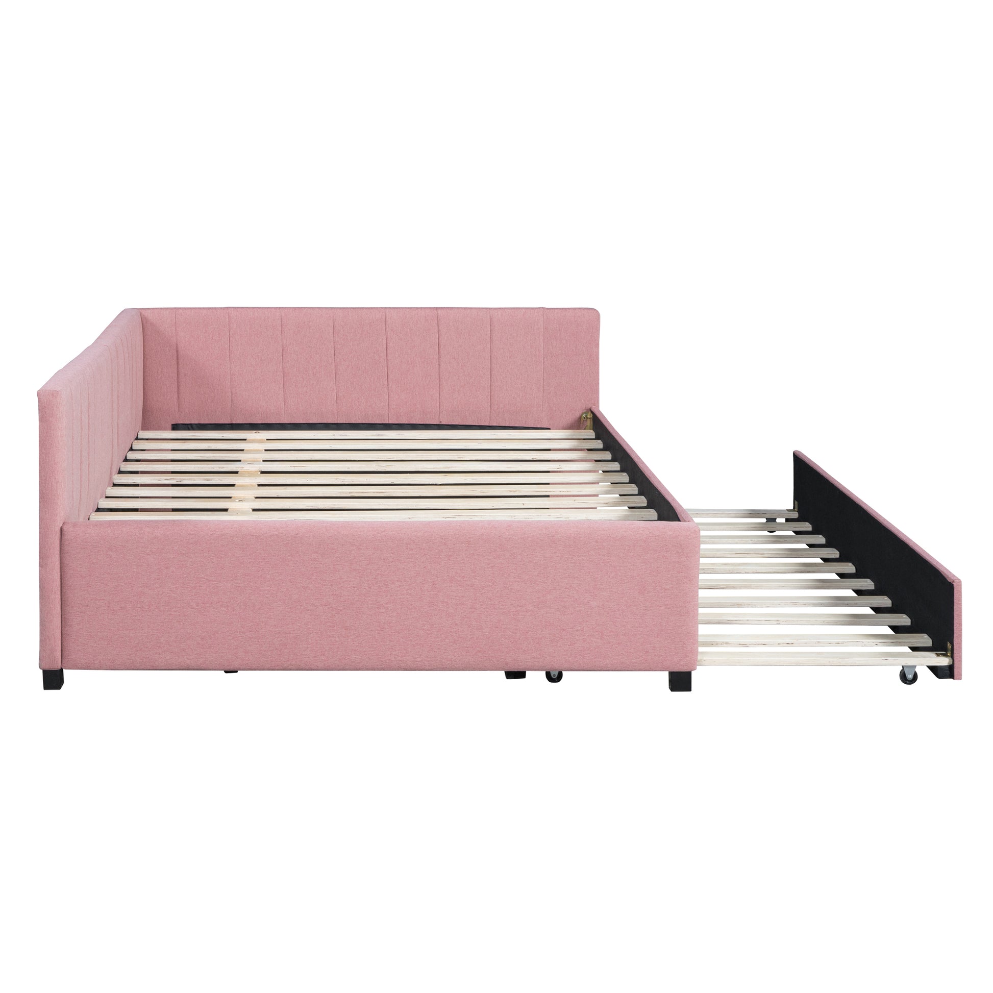 Pink upholstered daybed with pullout trundle bed and slatted support