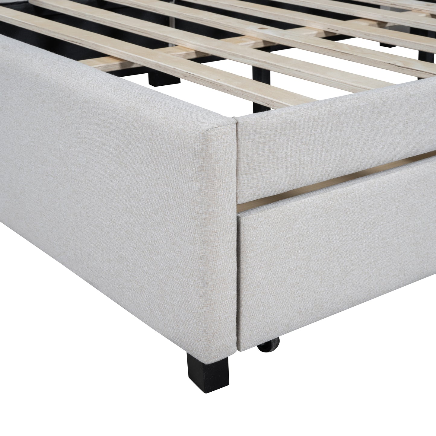 Closeup of a beige upholstered bed frame with wooden slats