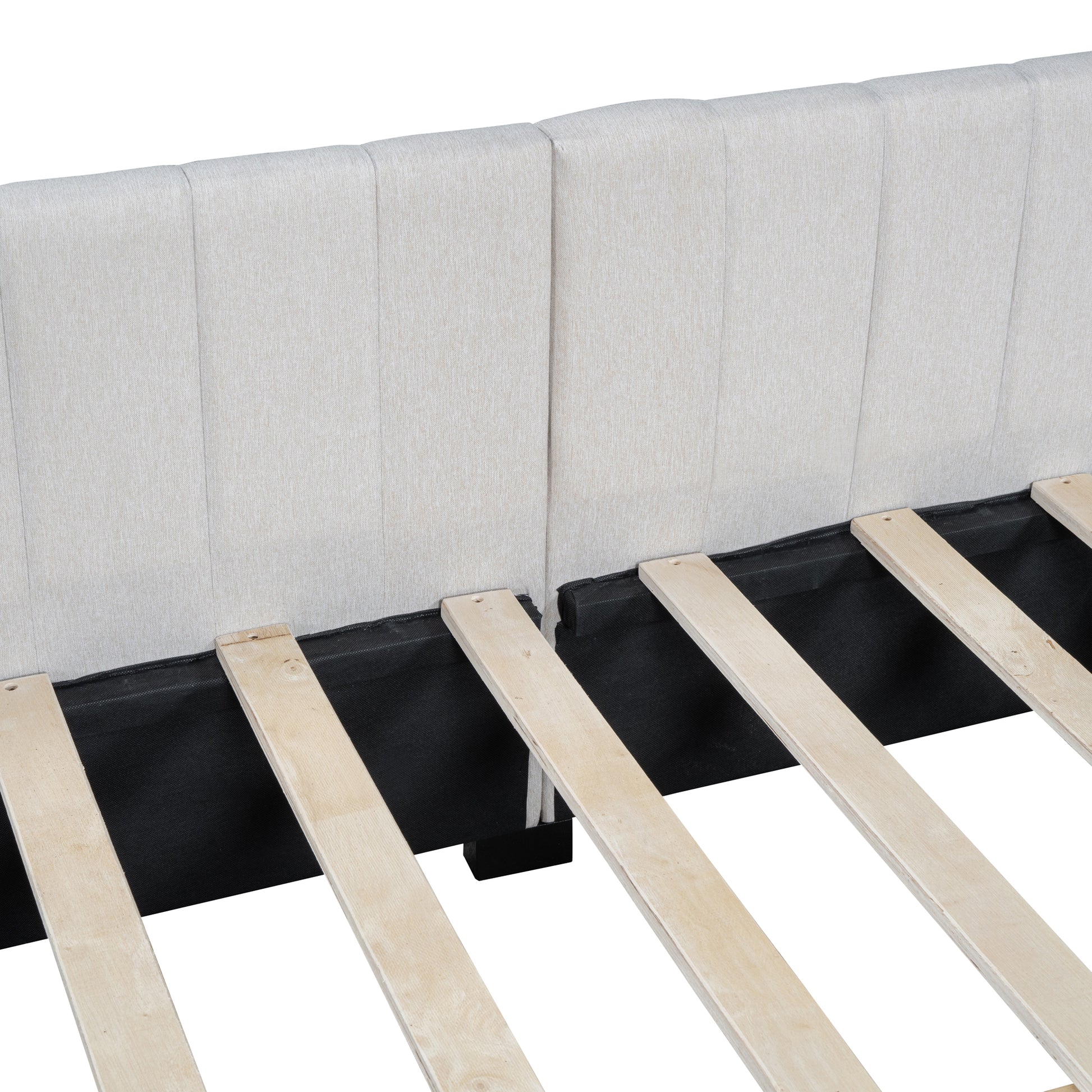 Cream upholstered bed frame with wooden slats visible