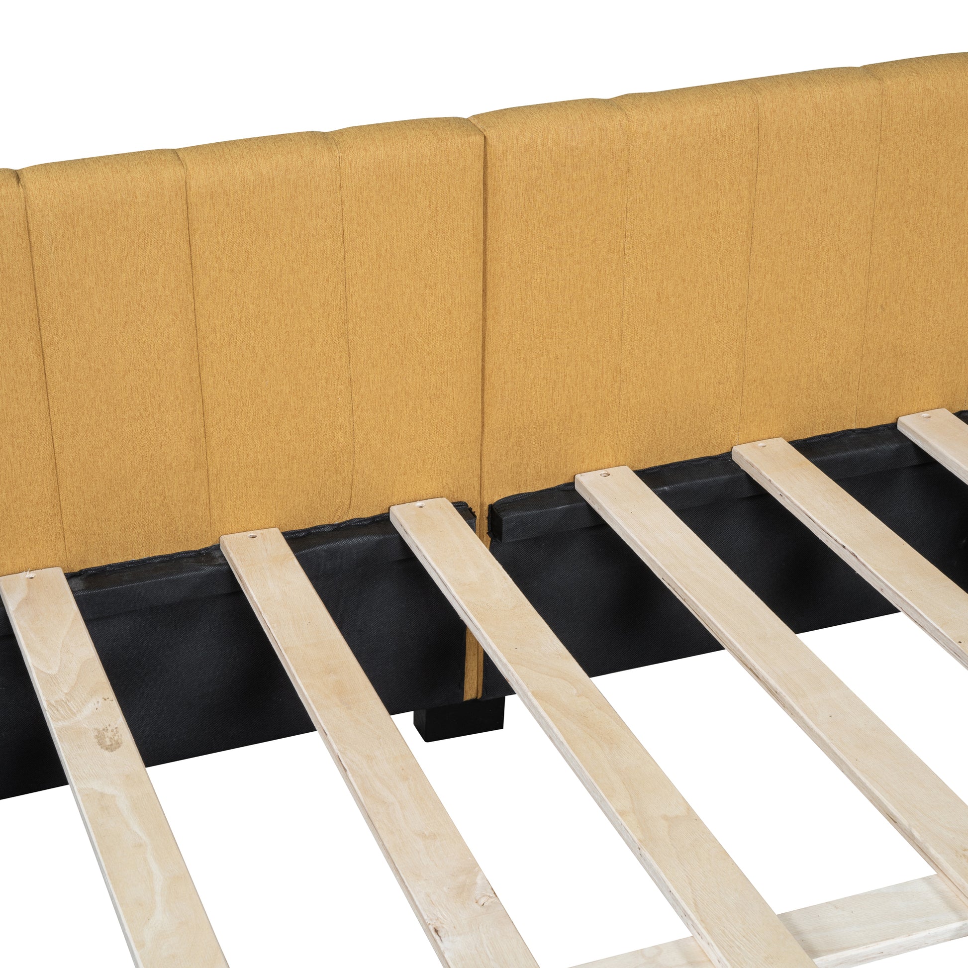 Closeup of mustard yellow upholstered headboard for a modern bed frame