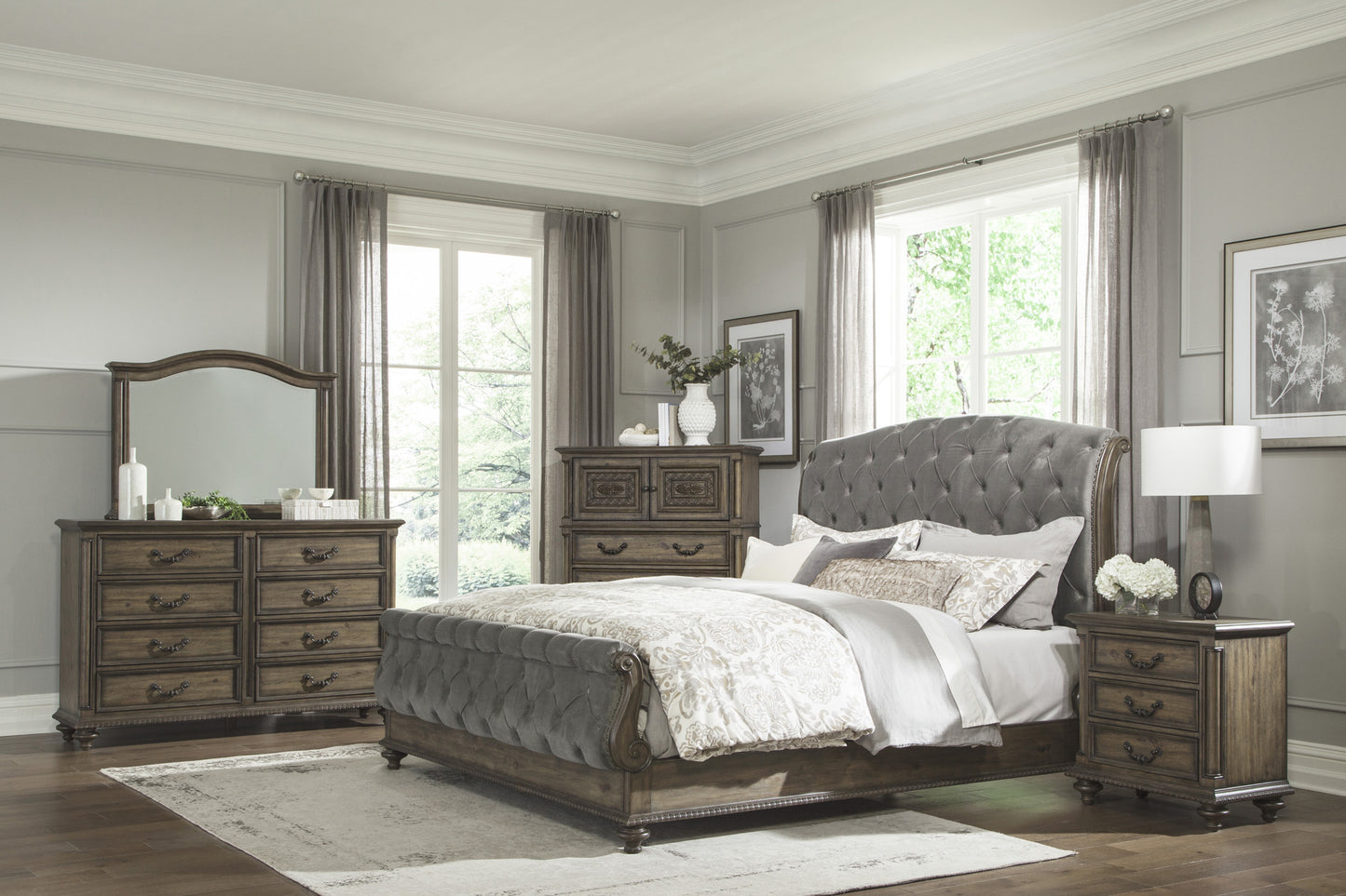 Tufted grey velvet king bed with ornate wooden frame and matching nightstand