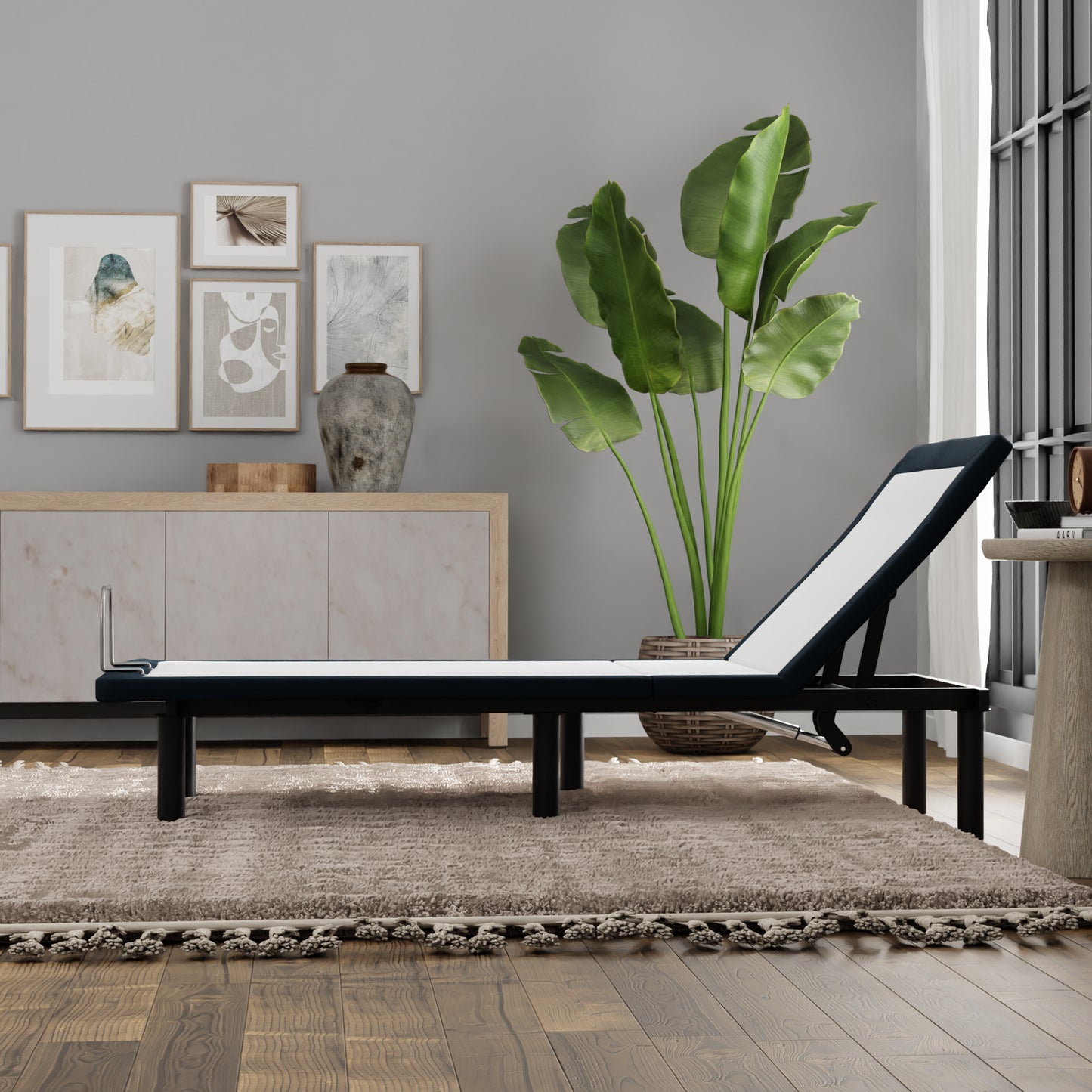 Black metal adjustable chaise lounge with white cushion