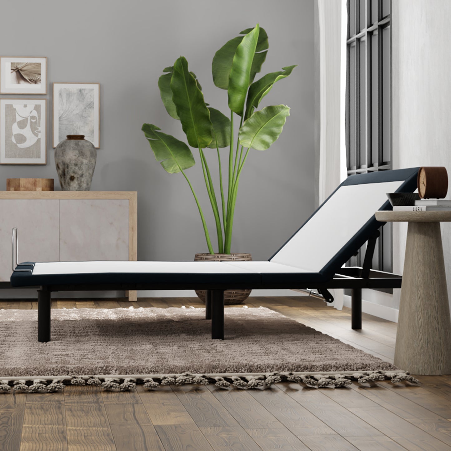 Adjustable bed frame with white mattress and navy blue upholstery