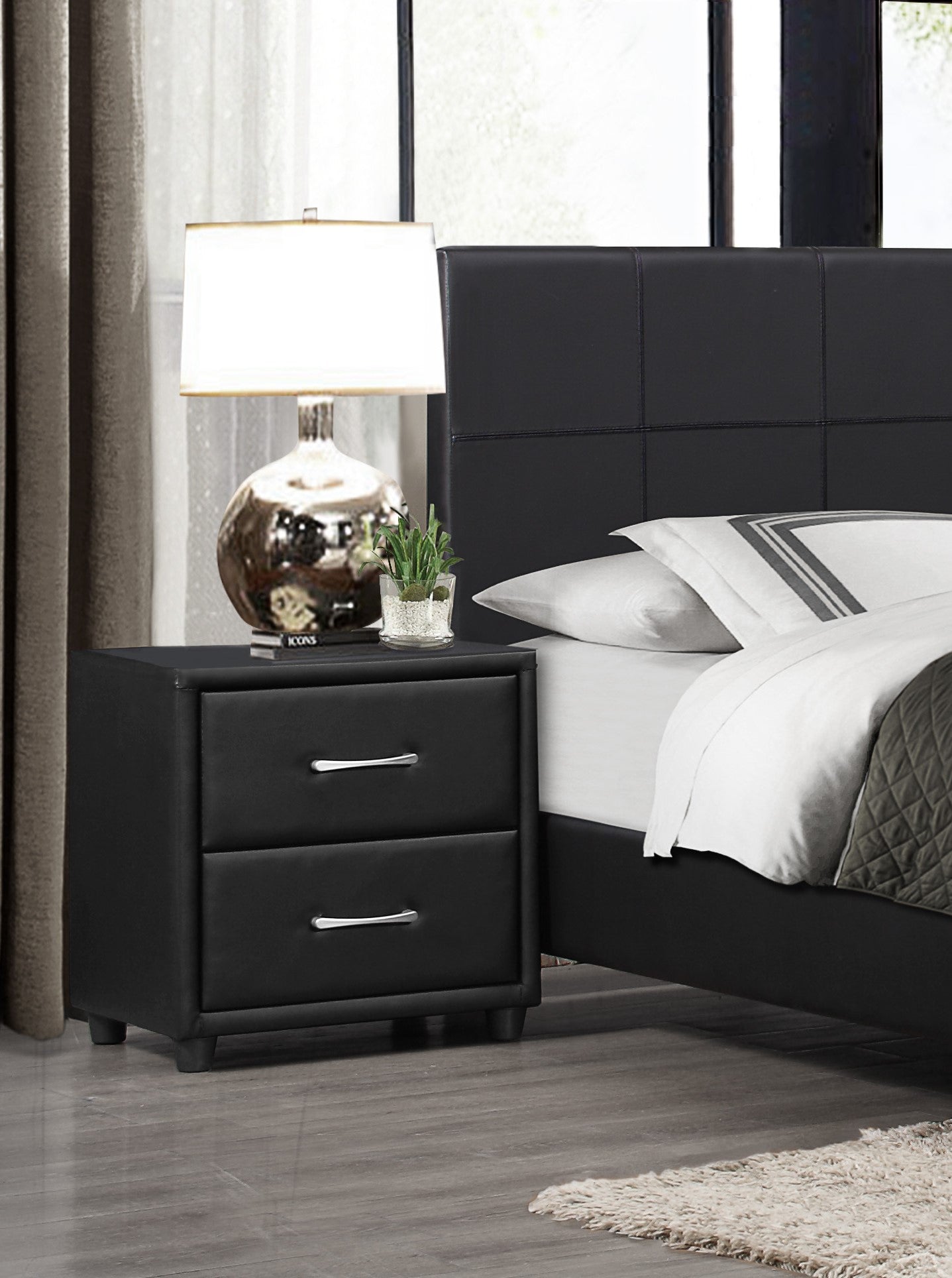 Black faux leather nightstand with two drawers and silver pulls