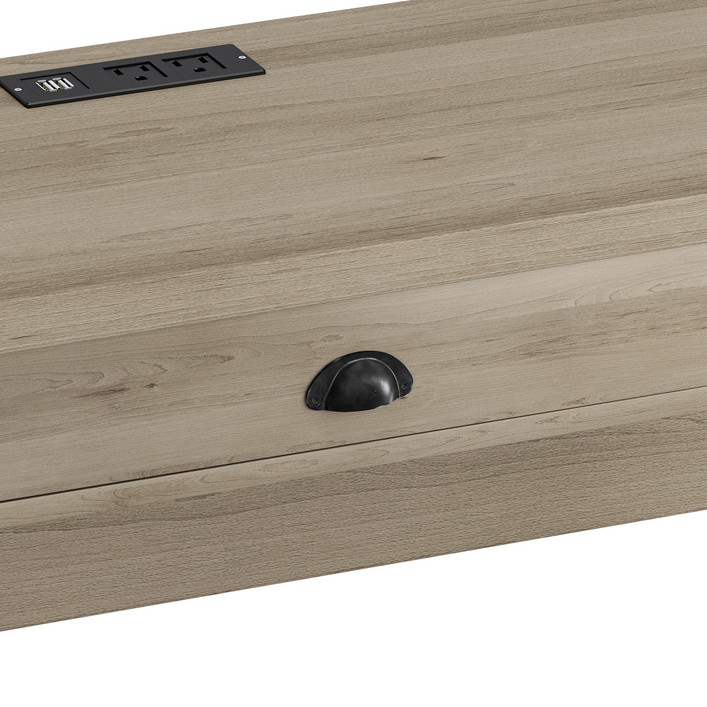 Closeup of integrated power strip with USB ports on a wood grain desk