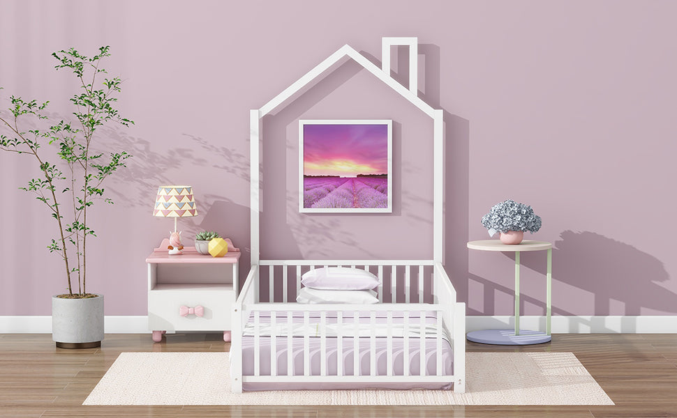 White wooden toddler bed with houseshaped frame and lavender bedding