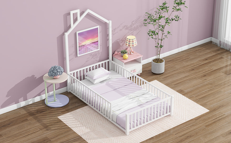 White wooden toddler bed with houseshaped headboard