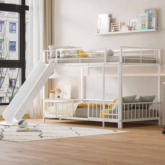 White metal twin over twin bunk bed with a slide and guardrails