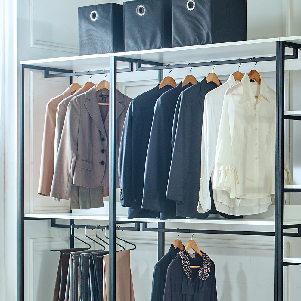 Tan blazer and grey skirt set on a clothing rack