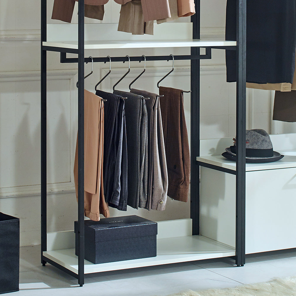 Tan dress pants hanging on a modern garment rack