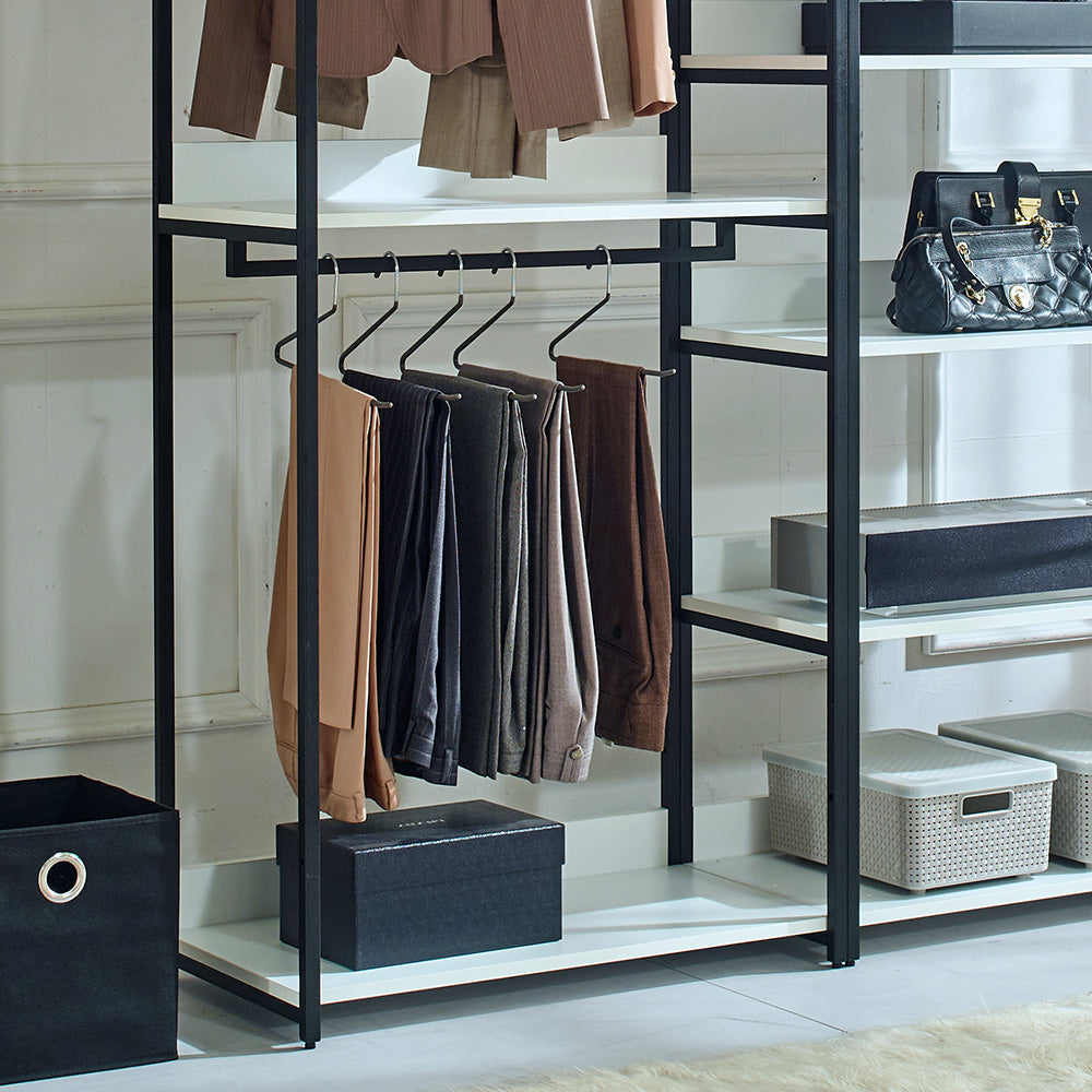 Beige tailored trousers hanging in a modern closet