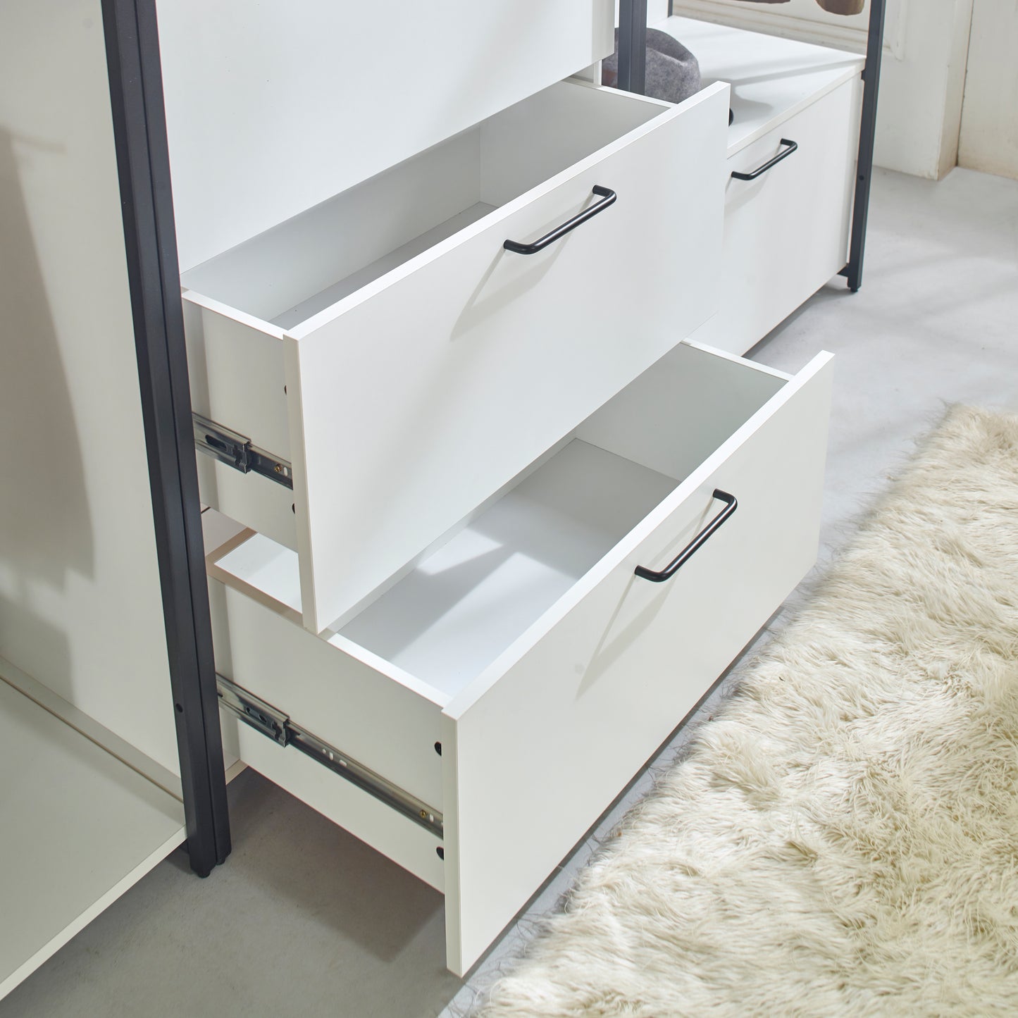 White storage cabinet with two open drawers