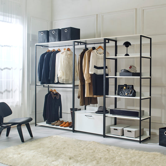 Modern open closet rack with hanging womens clothing and accessories