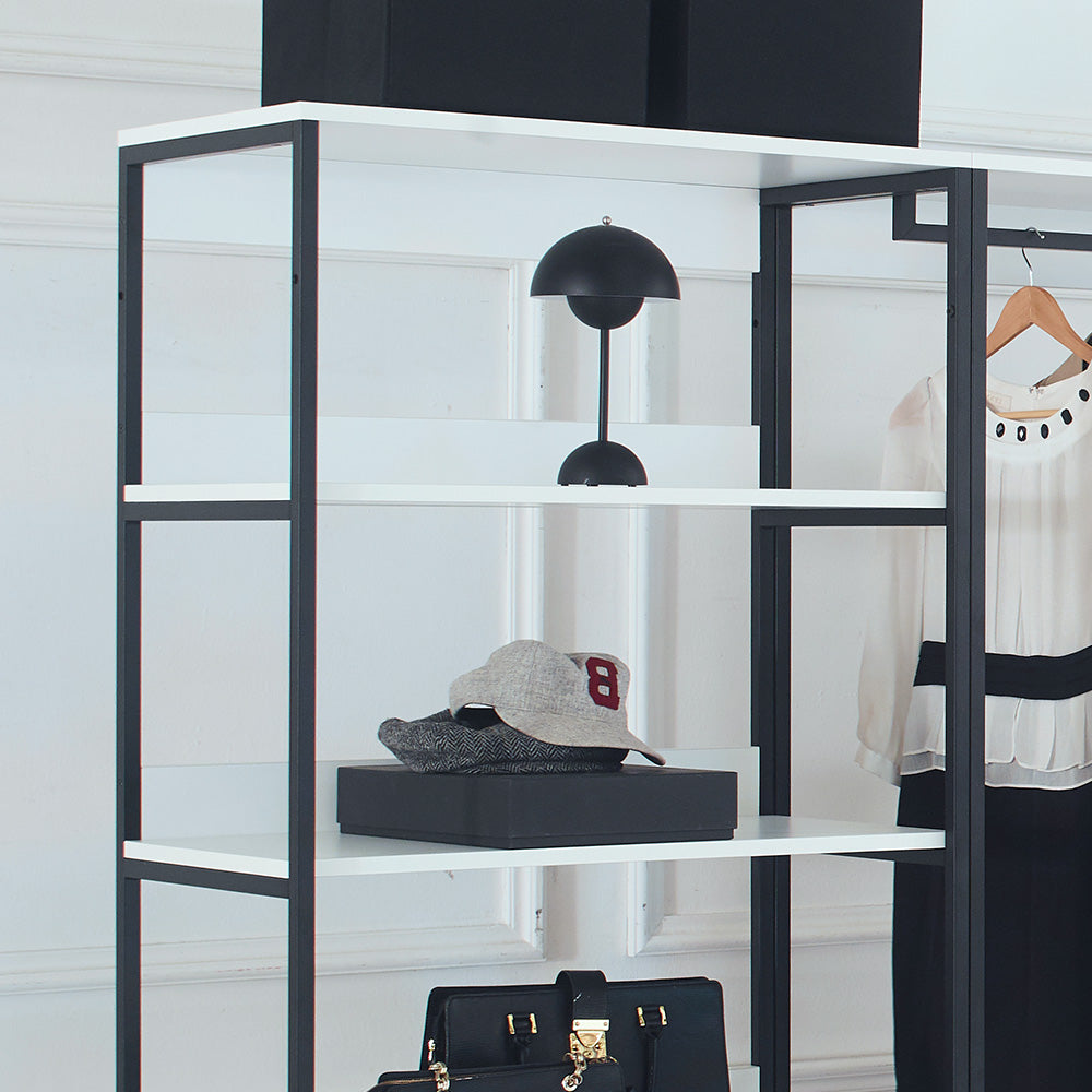 Black domeshaped desk lamp with a thin stand on a white shelf