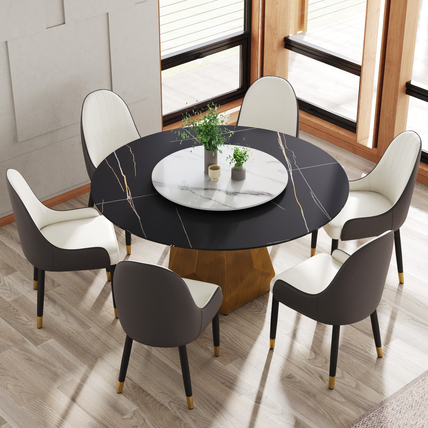 Black marble dining table with gold accents and plush cream chairs