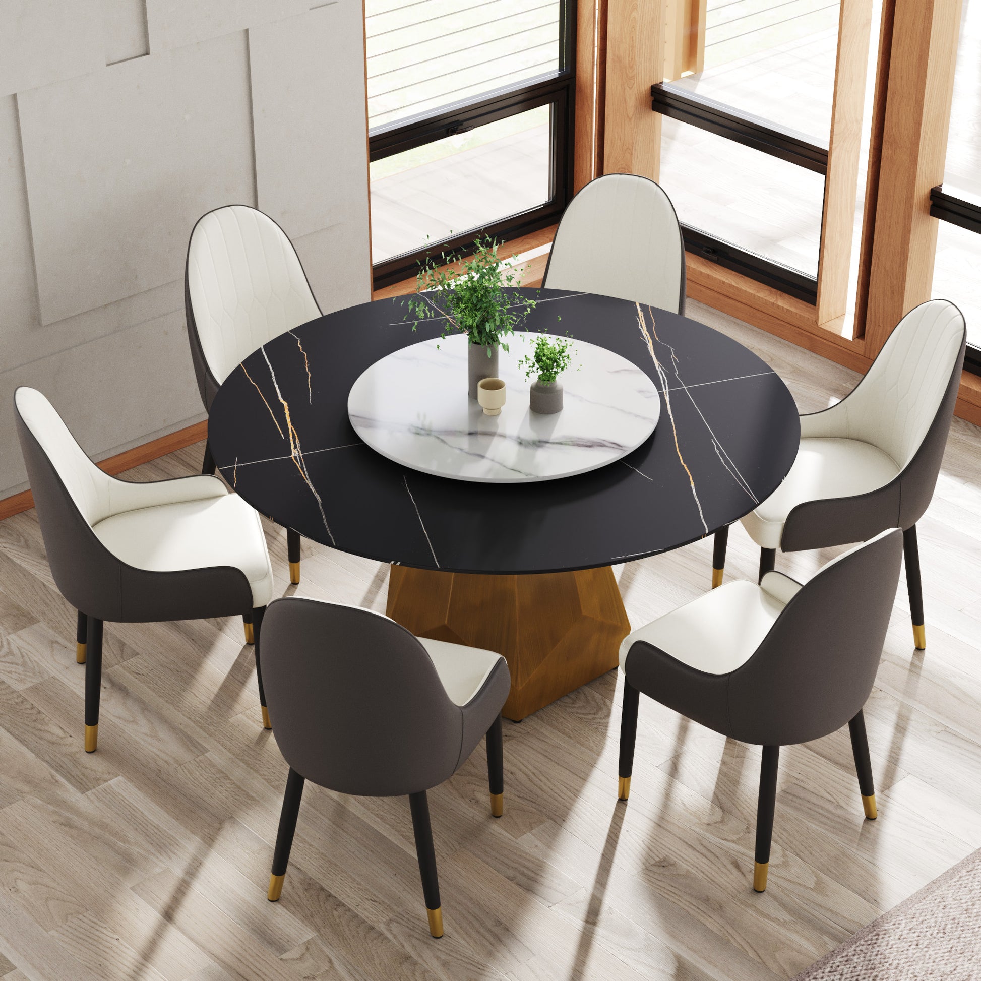 Black marble dining table with gold accents and plush cream chairs