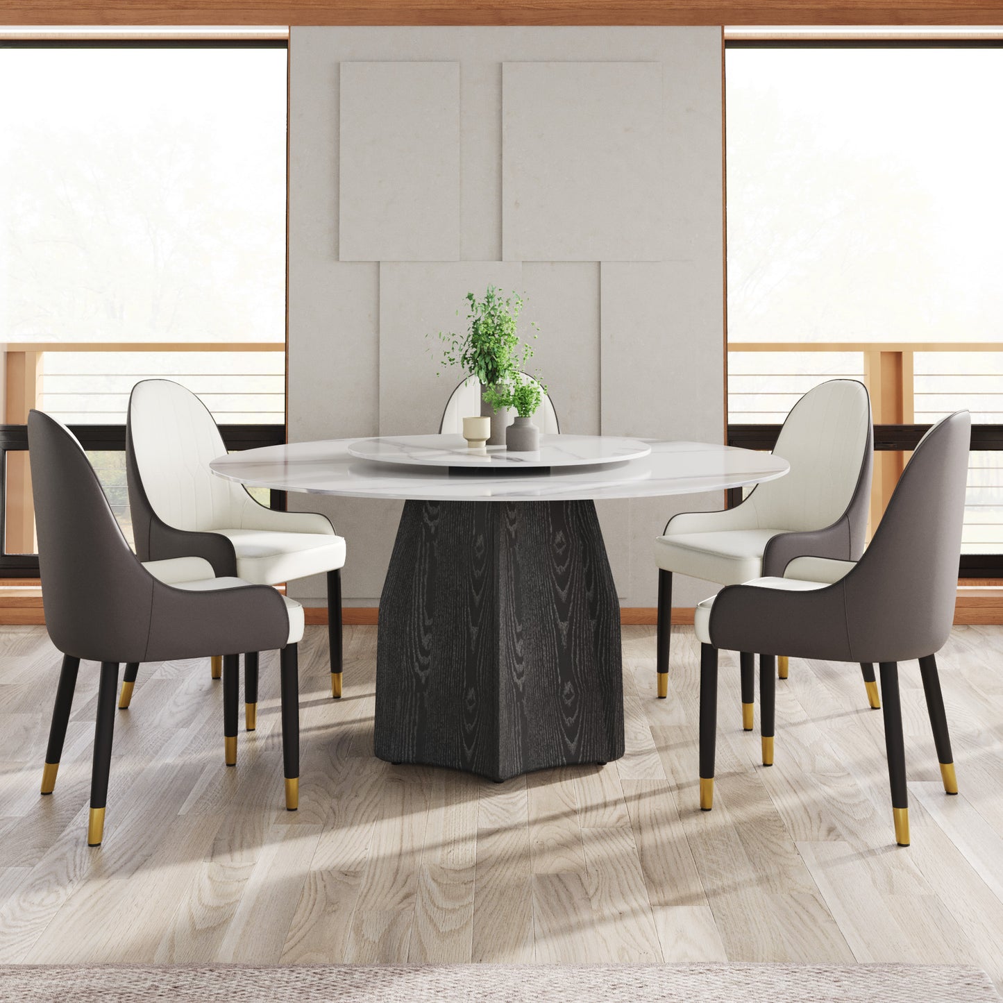 Modern round marble dining table with a dark wood pedestal base and four chairs