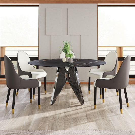 Round marble dining table with gold veining and unique sculptural base