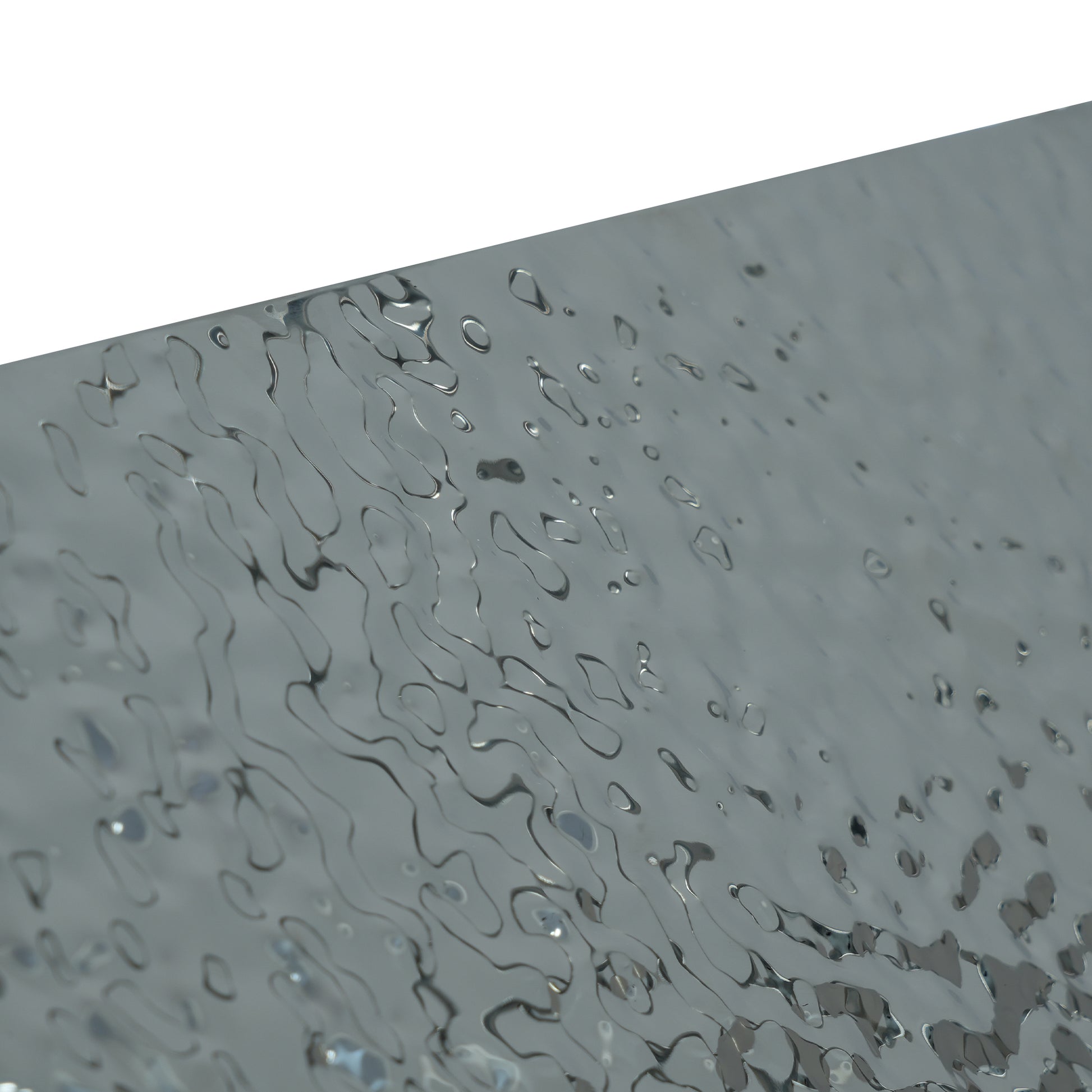 Textured silver metal sheet with organic wavy patterns
