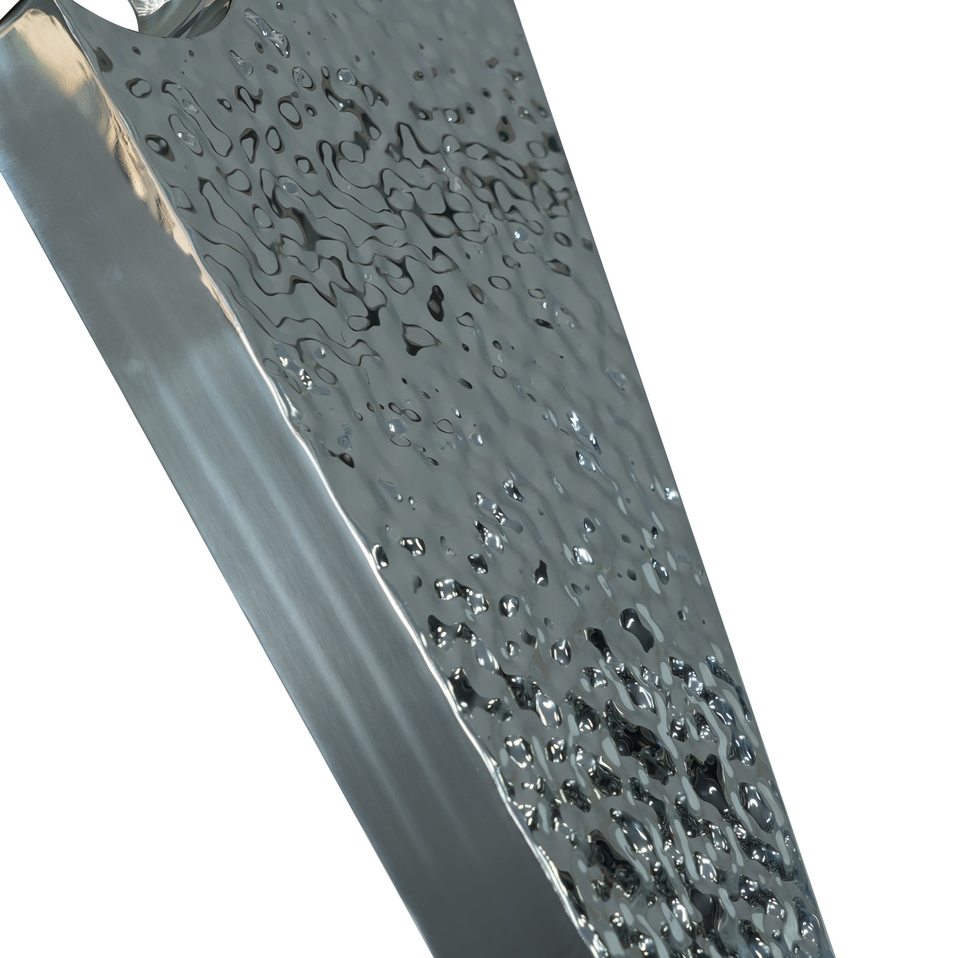 Closeup of hammered silver serving tray with reflective surface