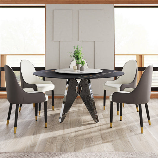 Black marble dining table with chrome base and four upholstered chairs