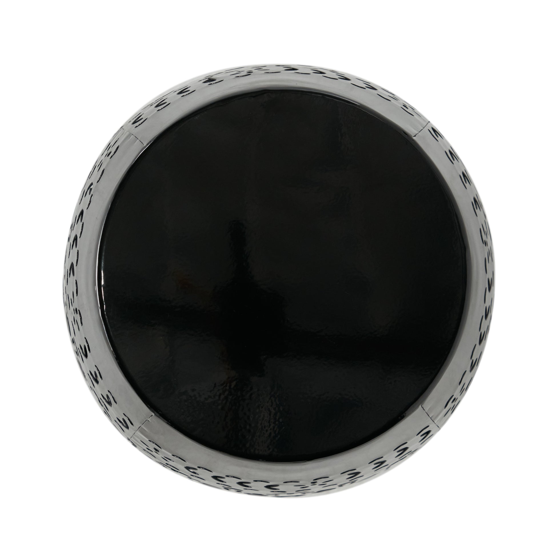 Black metallic round planter with cutout decorative pattern