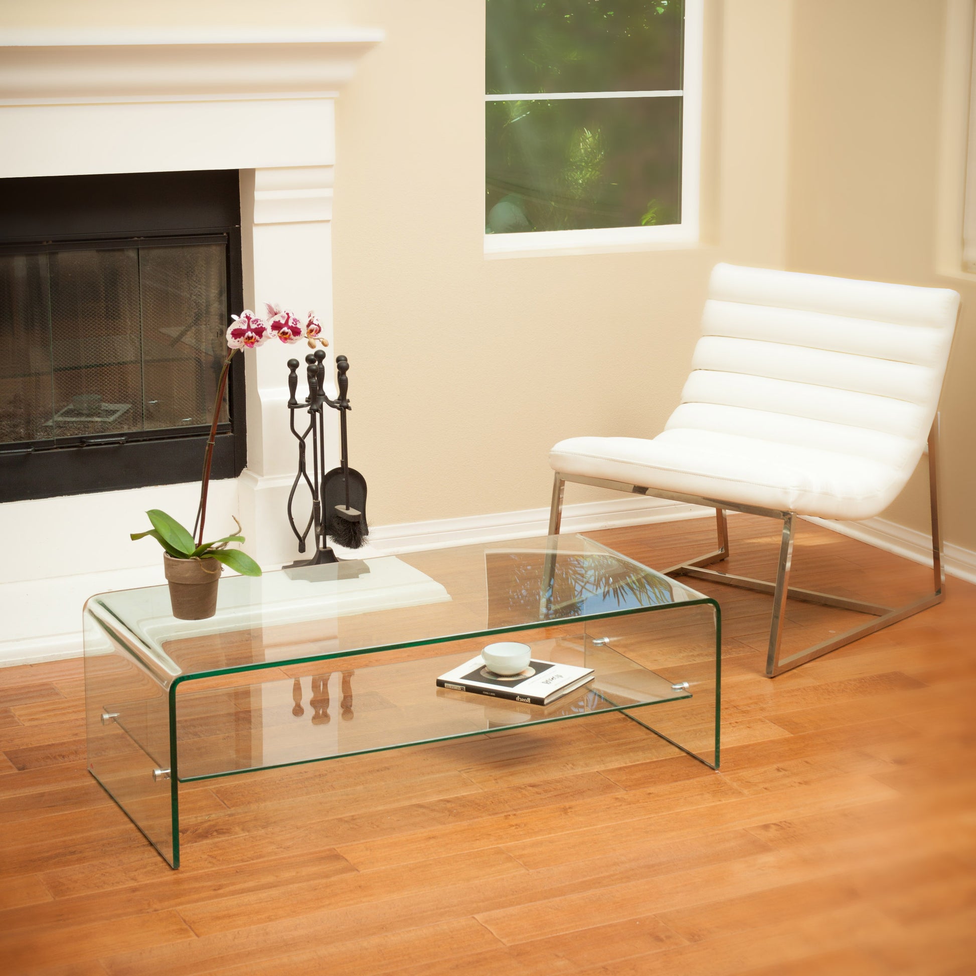 Curved glass coffee table with a sleek design and minimalist appeal