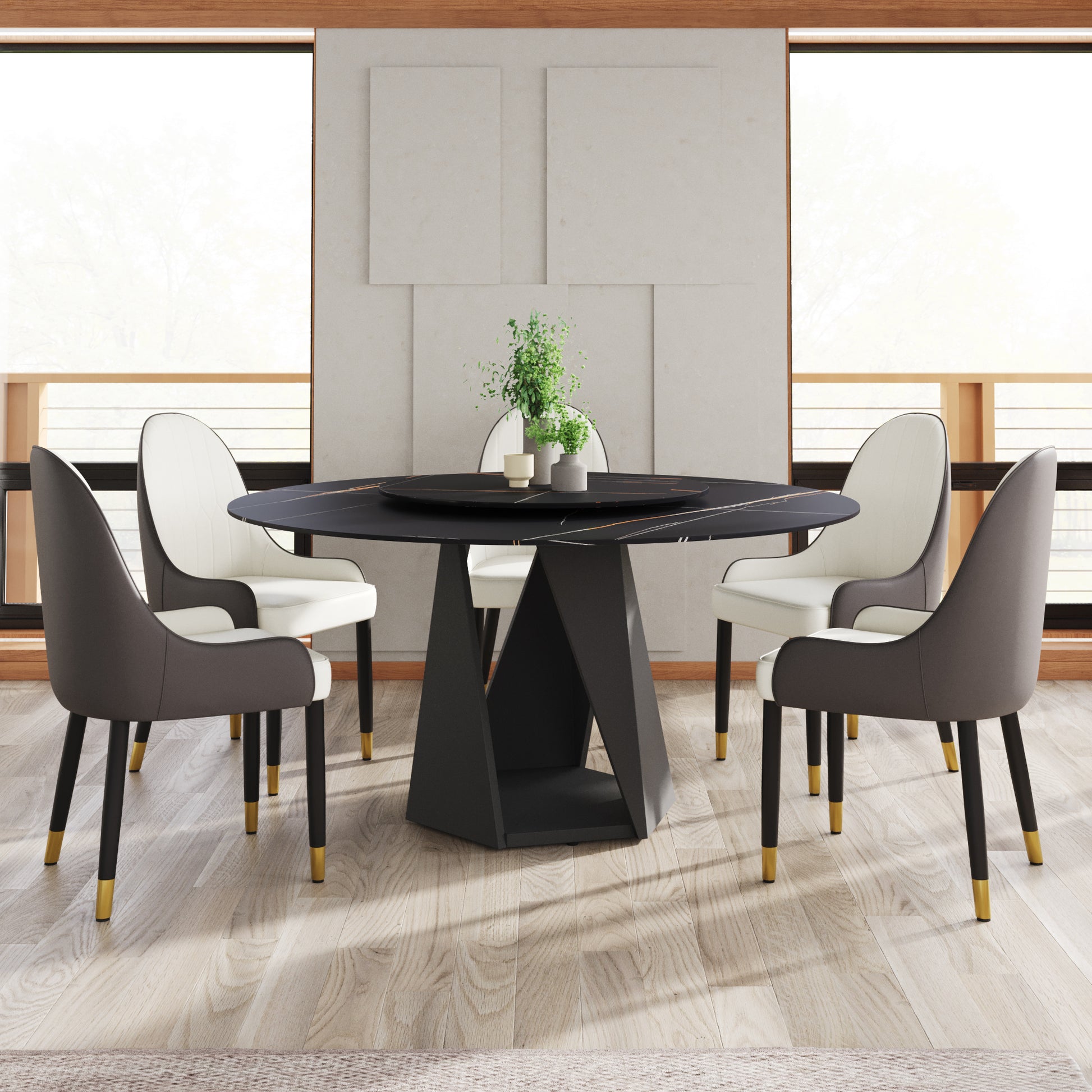 Modern round black marble dining table with gold accents and four upholstered chairs
