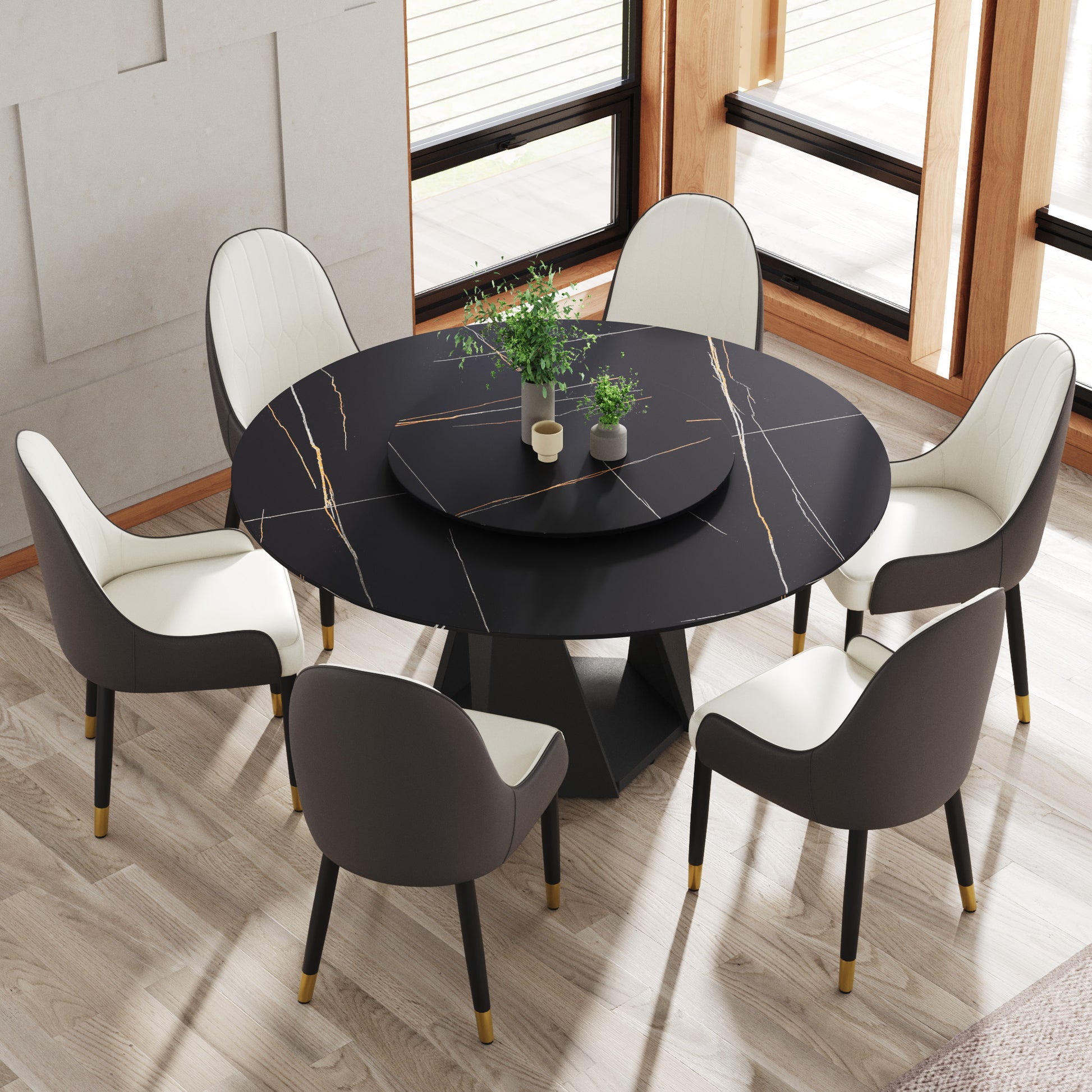 Modern black marble dining table with lazy Susan and upholstered chairs