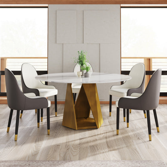 Round marble dining table with gold geometric base and twotone upholstered chairs