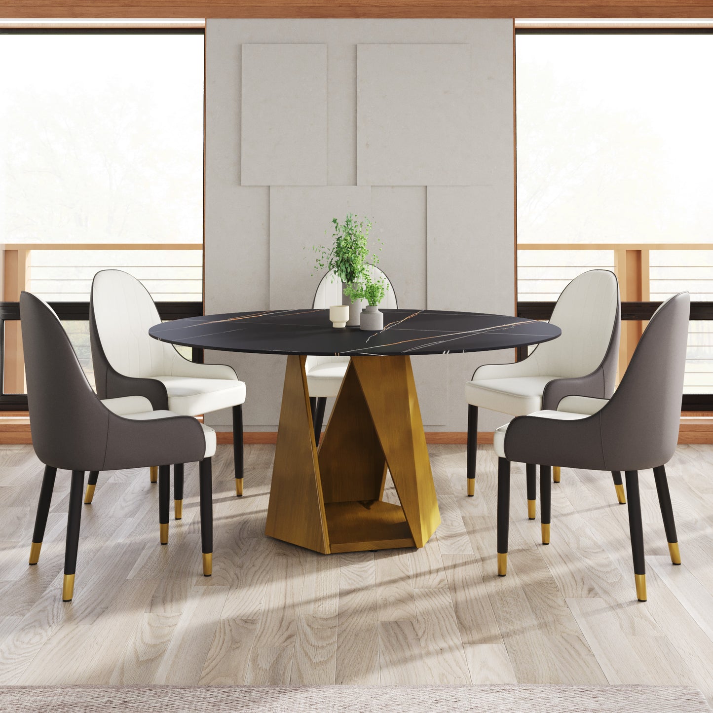 Black marble dining table with gold geometric base and white  gray upholstered chairs