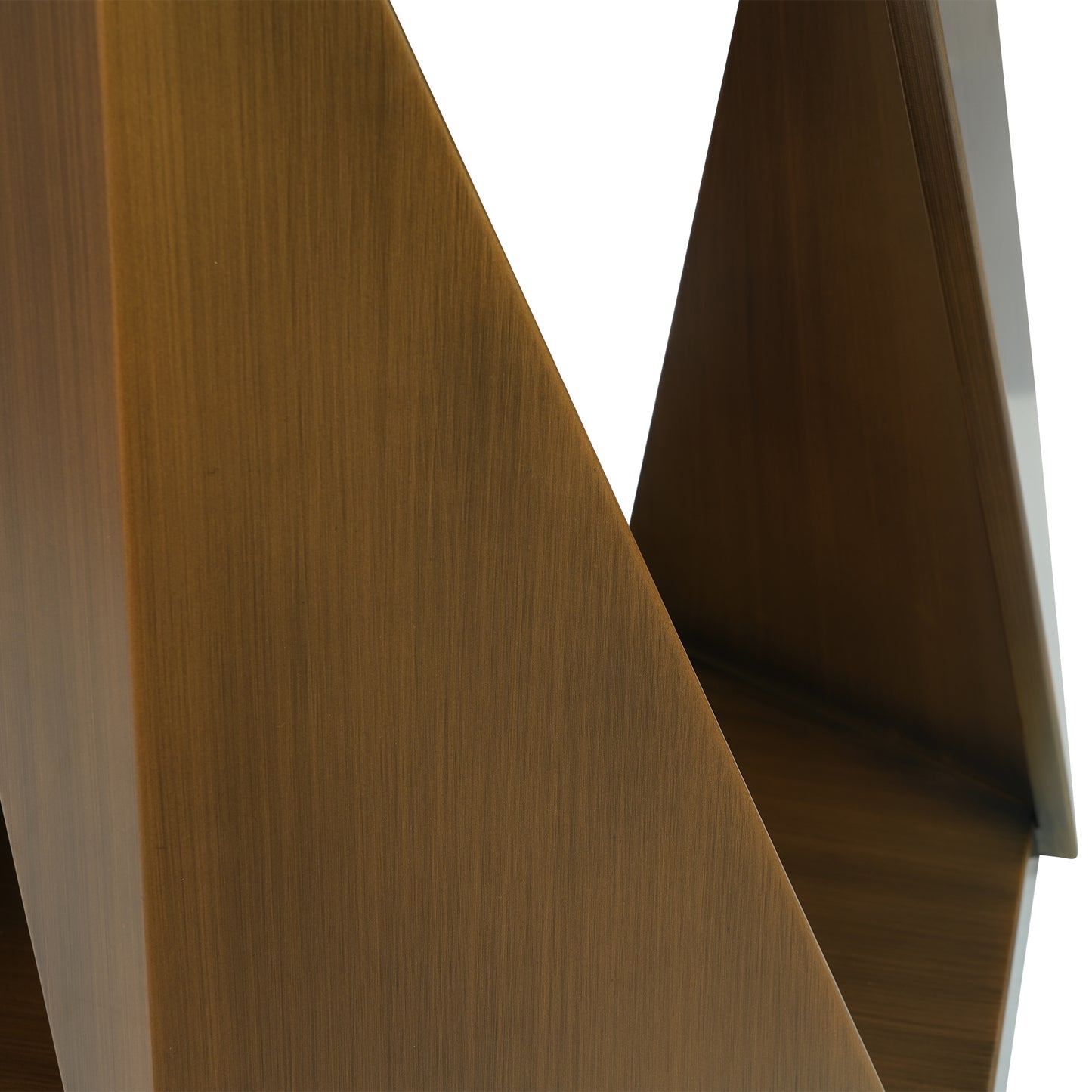 Brushed bronze metal abstract sculpture with sharp angles