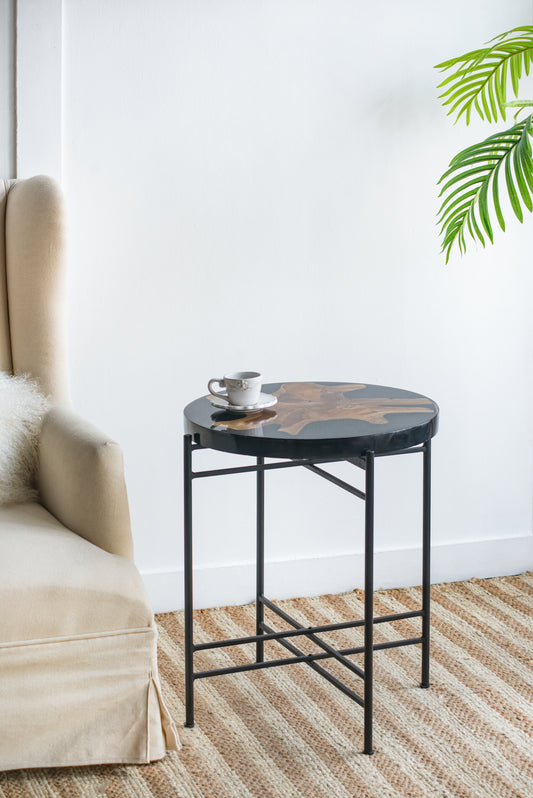 Round wood resin accent table with black metal legs perfect for modern living rooms