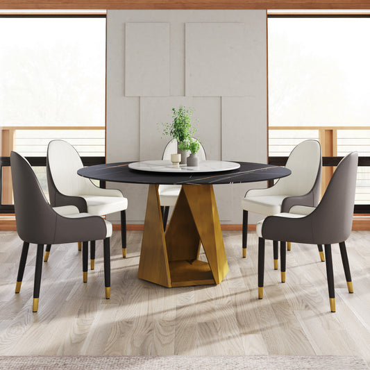 Black marble dining table with gold geometric base and upholstered chairs