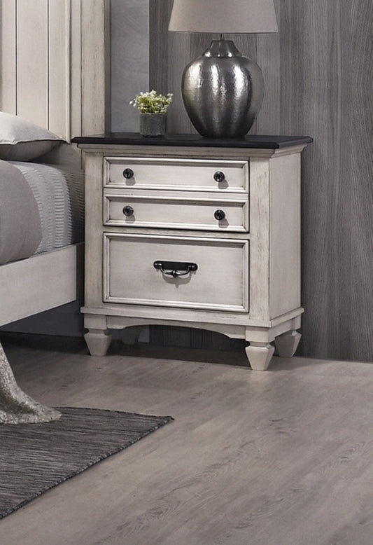 Cream distressed wood nightstand with two drawers and black hardware