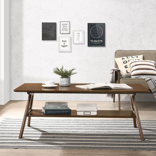 Dark brown wooden coffee table with a lower shelf and a plant