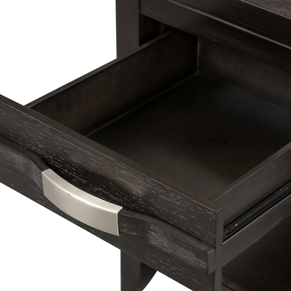 Dark wood nightstand drawer with brushed nickel handle pulled out