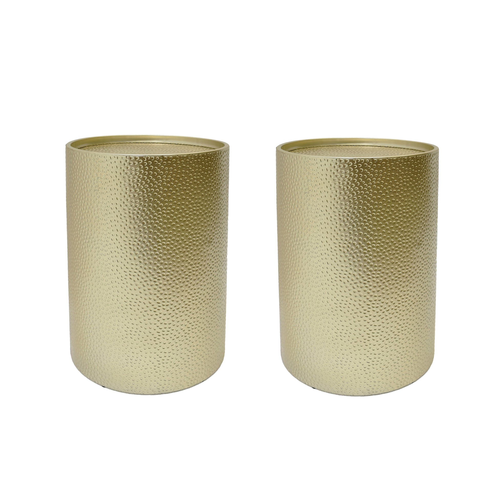 Two round hammered gold end tables with a metallic finish
