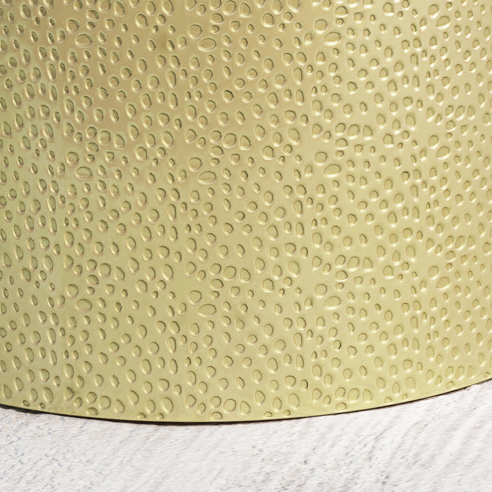 Hammered gold metal planter with textured pebblelike indentations
