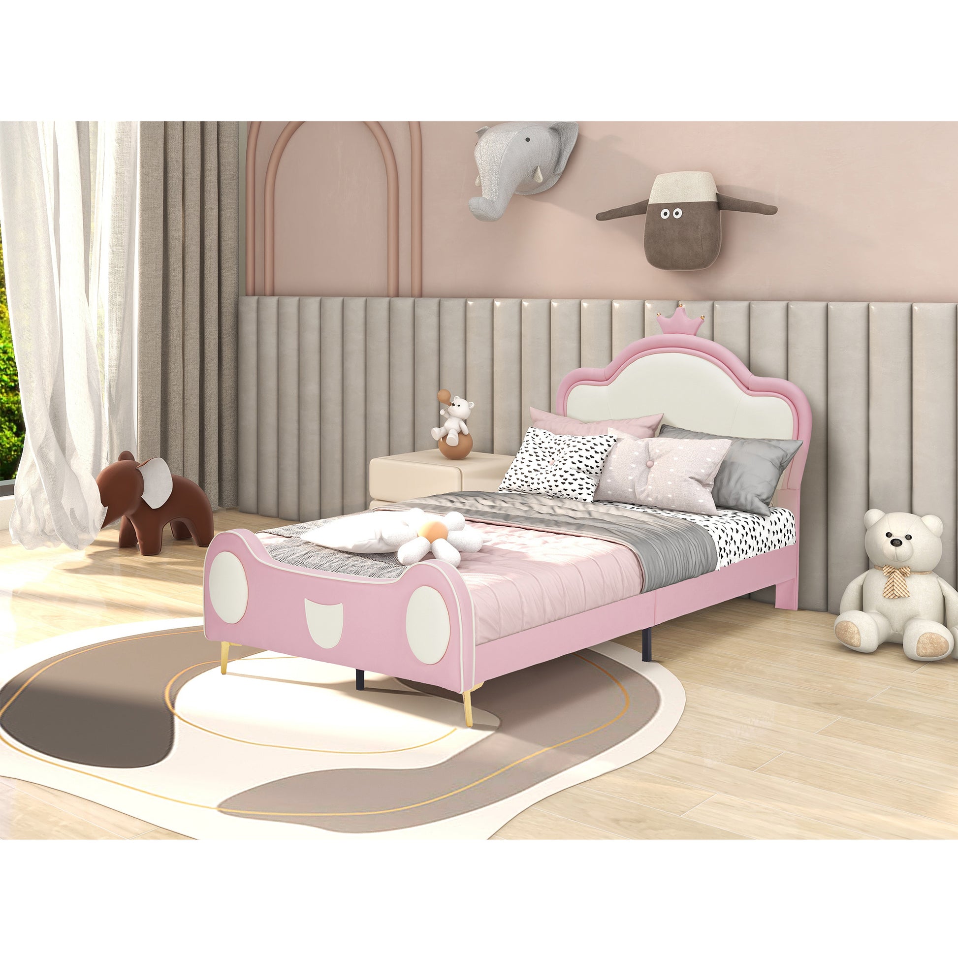 Pink upholstered twin bed with a crown headboard