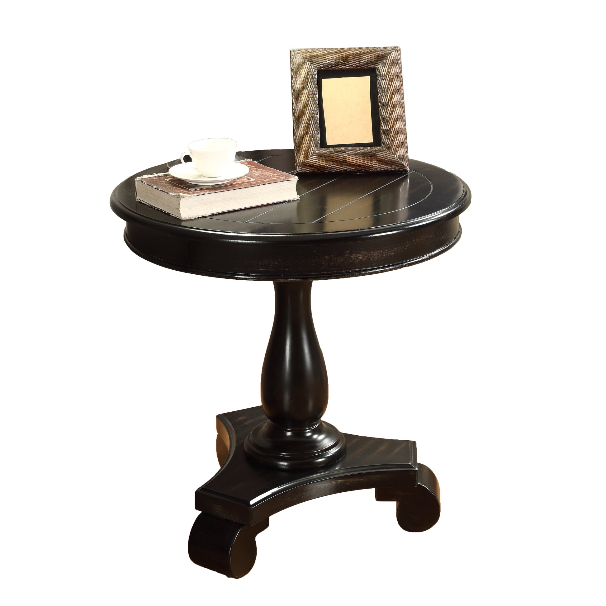 Dark wood round end table with ornate pedestal base and carved details