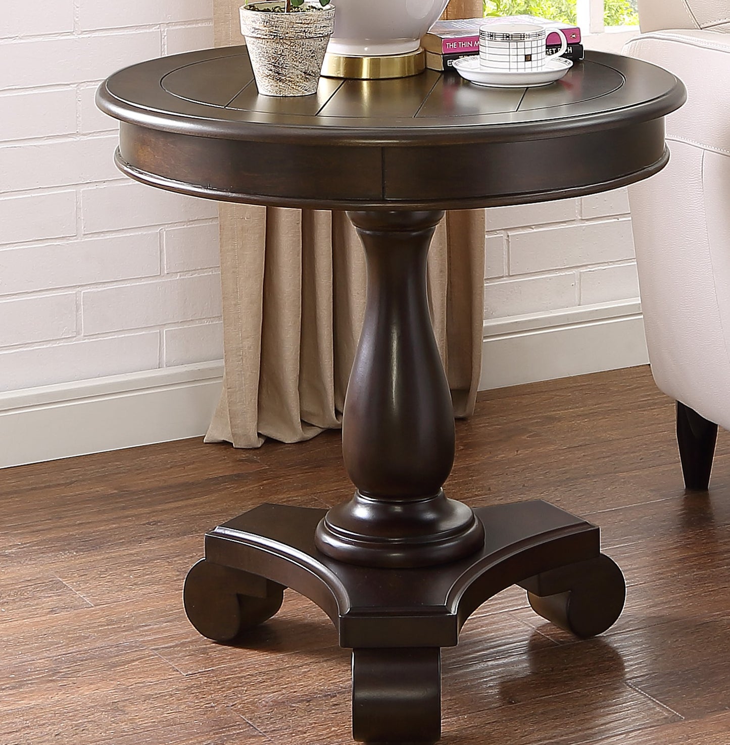 Dark wood round accent table with pedestal base ideal for living room corners