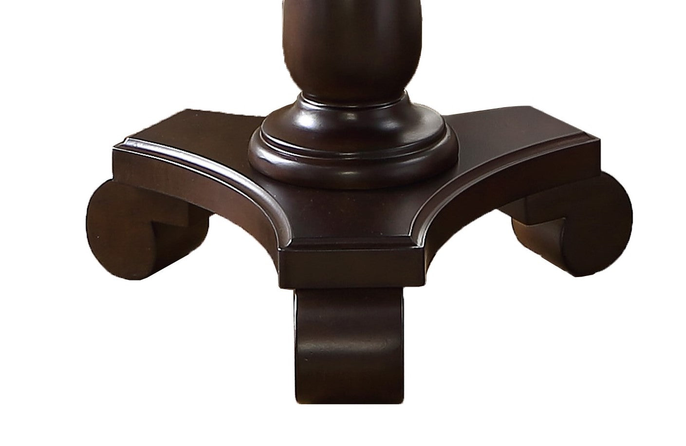 Dark wood pedestal base with decorative scrolled feet for a classic dining table