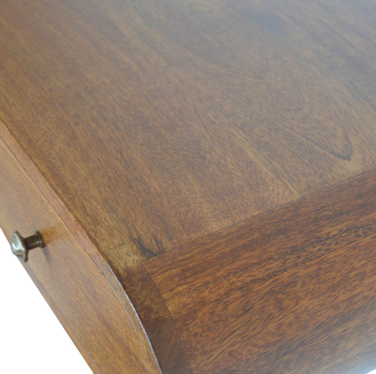 Rich brown wood grain finish on a curved desk drawer with antique brass knob