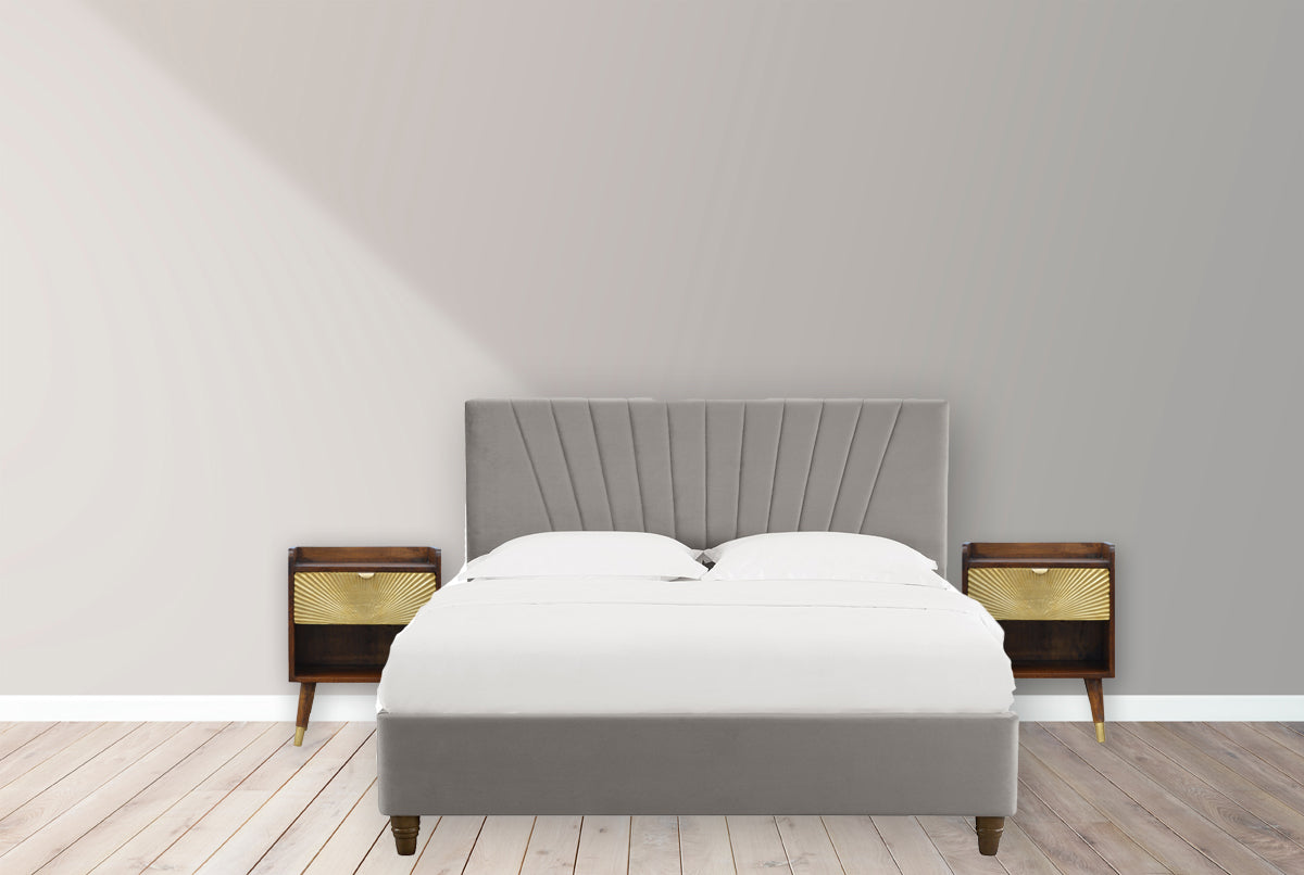 Plush grey velvet platform bed with a fluted headboard showcasing comfort and modern design