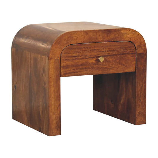 Curved solid wood bedside table with brass knob drawer