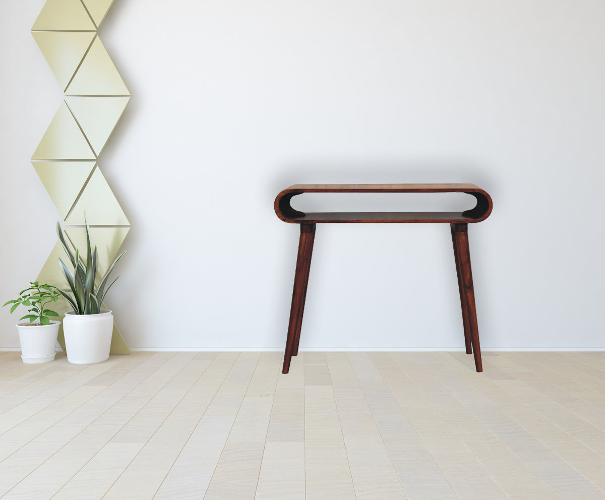Dark wood console table with curved open shelf and tapered legs