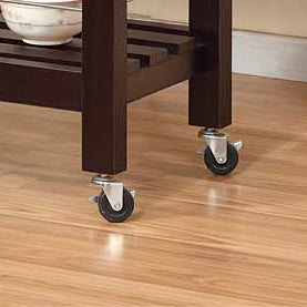 Dark brown kitchen island legs with locking casters on hardwood floor