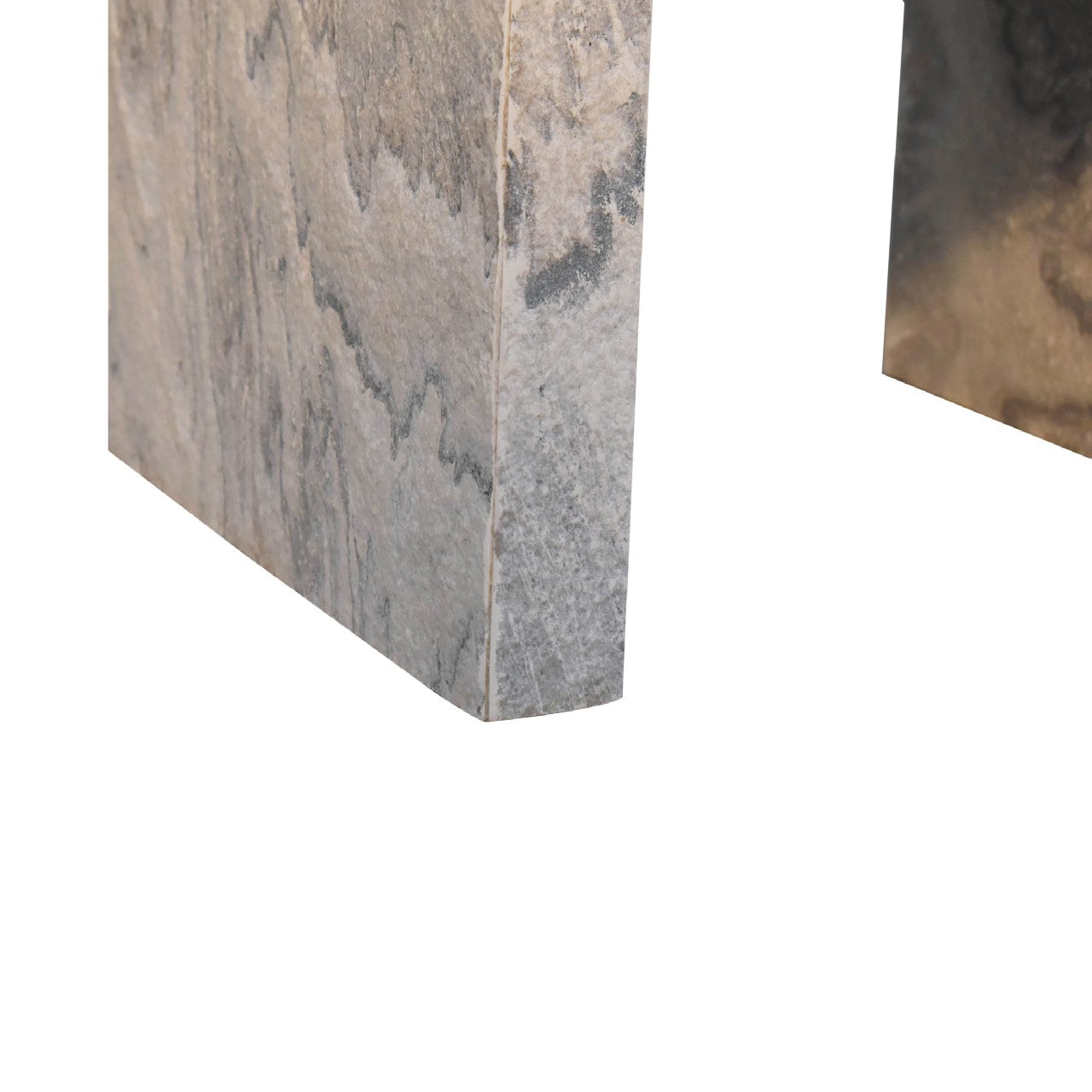Closeup of a polished stone slab with grey veining suitable for countertops